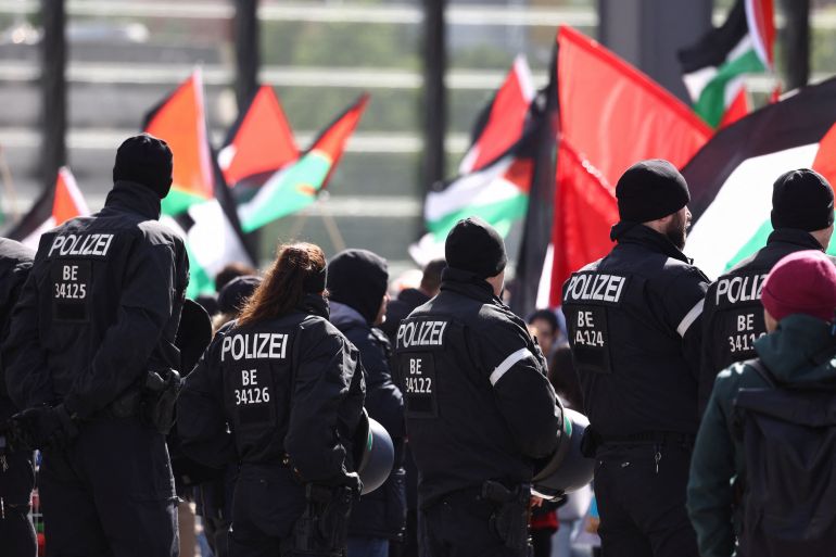 Police officers stand guard, while pro-Palestinian demonstrators gather, as they demand "No weapons for Israel", during a protest march, amid the ongoing conflict between Israel and the Palestinian Islamist group Hamas, in Berlin, Germany, April 20, 2024. REUTERS/Liesa Johannssen