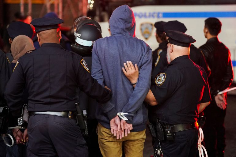 olice detain a protestor, as other police officers enter the campus of Columbia University, during the ongoing conflict between Israel and the Palestinian Islamist group Hamas, in New York City, U.S., April 30, 2024. REUTERS/David Dee Delgado