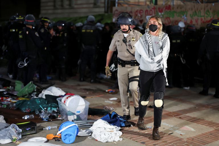 w enforcement officer detains a protester at the University of California Los Angeles (UCLA), during a pro-Palestinian protest, as the conflict between Israel and the Palestinian Islamist group Hamas continues, in Los Angeles, California, U.S., May 2, 2024. REUTERS/Mike Blake