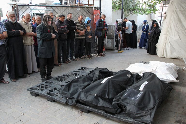 Mourners react next to the bodies of Palestinians killed in an Israeli strike, amid the ongoing conflict between Israel and the Palestinian Islamist group Hamas, at Abu Yousef al-Najjar hospital in Rafah, in the southern Gaza Strip, May 5, 2024. REUTERS/Hatem Khaled
