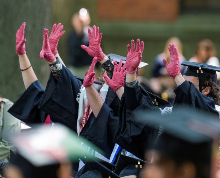 Graduates protest the conflict between Israel and the Palestinian Islamist group Hamas, during the commencement at Yale University, New Haven, Connecticut, U.S., May 20, 2024. REUTERS/Michelle McLoughlin