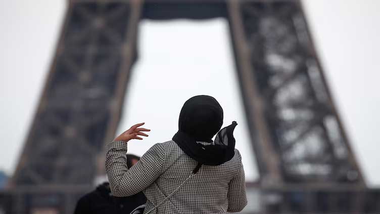 Journalist challenges rule banning hijab