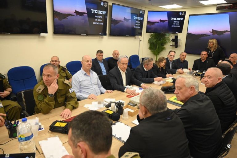 Israel's Prime Minister Benjamin Netanyahu (C) during a War Cabinet meeting at the Kirya in Tel Aviv
