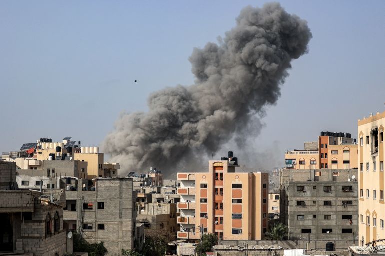 A bird flies past a plume of smoke towering during Israeli bombardment in Gaza City on April 18, 2024 amid the ongoing conflict in the Palestinian territory between Israel and the militant group Hamas. (Photo by AFP)