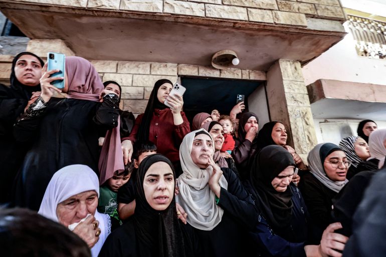 women wearing black in grieving