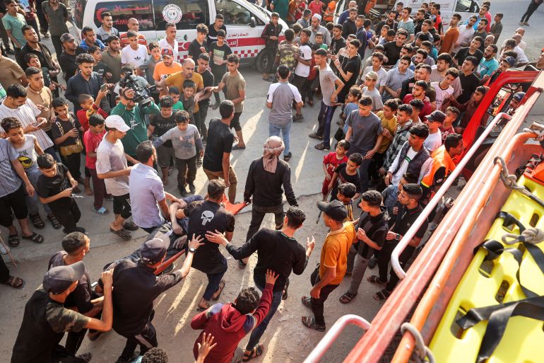 EDITORS NOTE: Graphic content / Palestinians transport an injured man pulled from the rubble of a house destroyed in an Israeli strike in the center of Rafah in the southern Gaza Strip on May 5, 2024, amid the ongoing conflict between Israel and the Palestinian Hamas movement. (Photo by AFP)