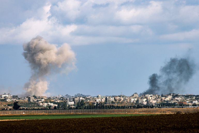 A smoke plume from an explosion billows in the Gaza Strip as seen from a position along Israel's southern border with the Palestinian territory on May 13, 2024 amid the ongoing conflict between Israel and the militant group Hamas. (Photo by JACK GUEZ / AFP)