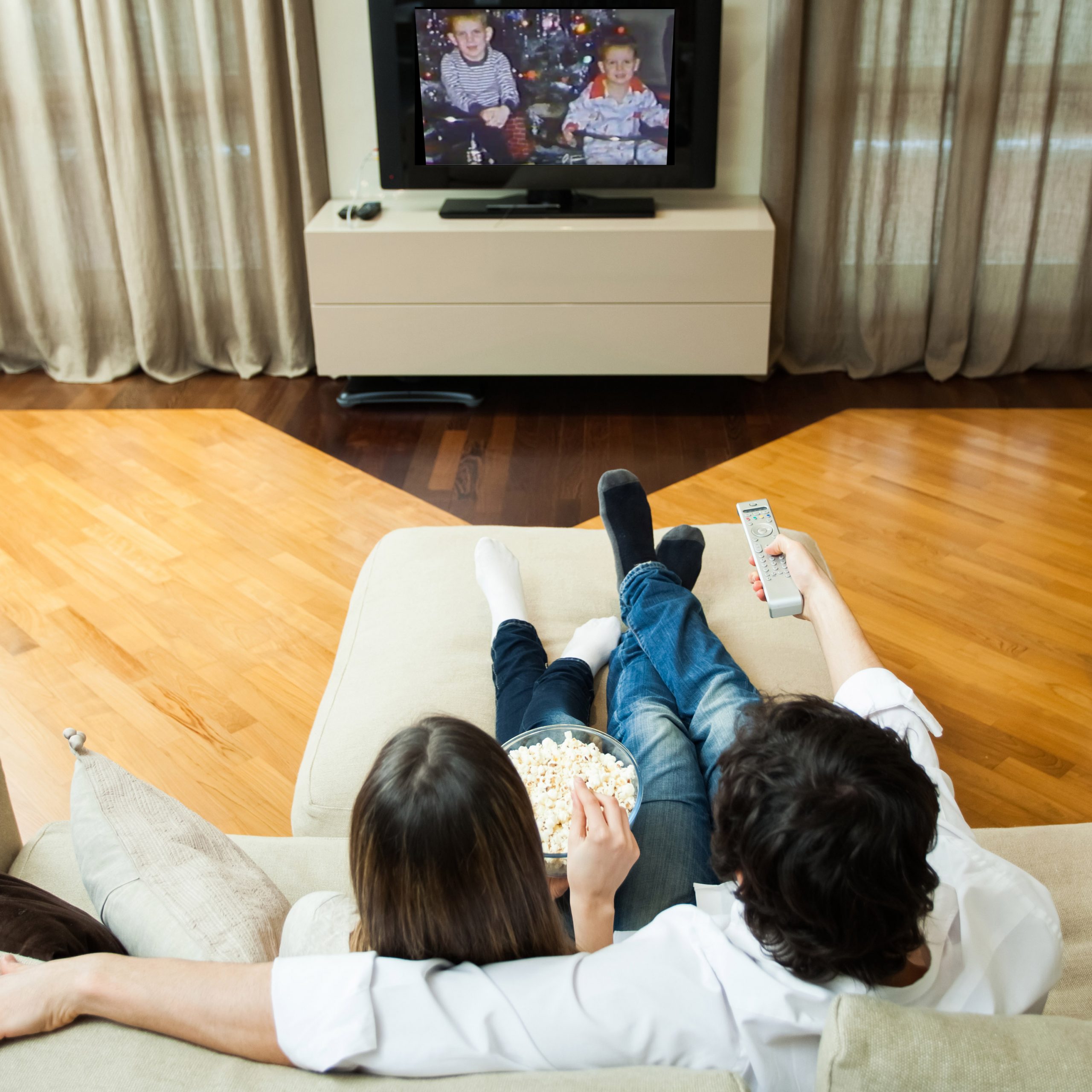 Home movie video transfer Couple watching home video transfer